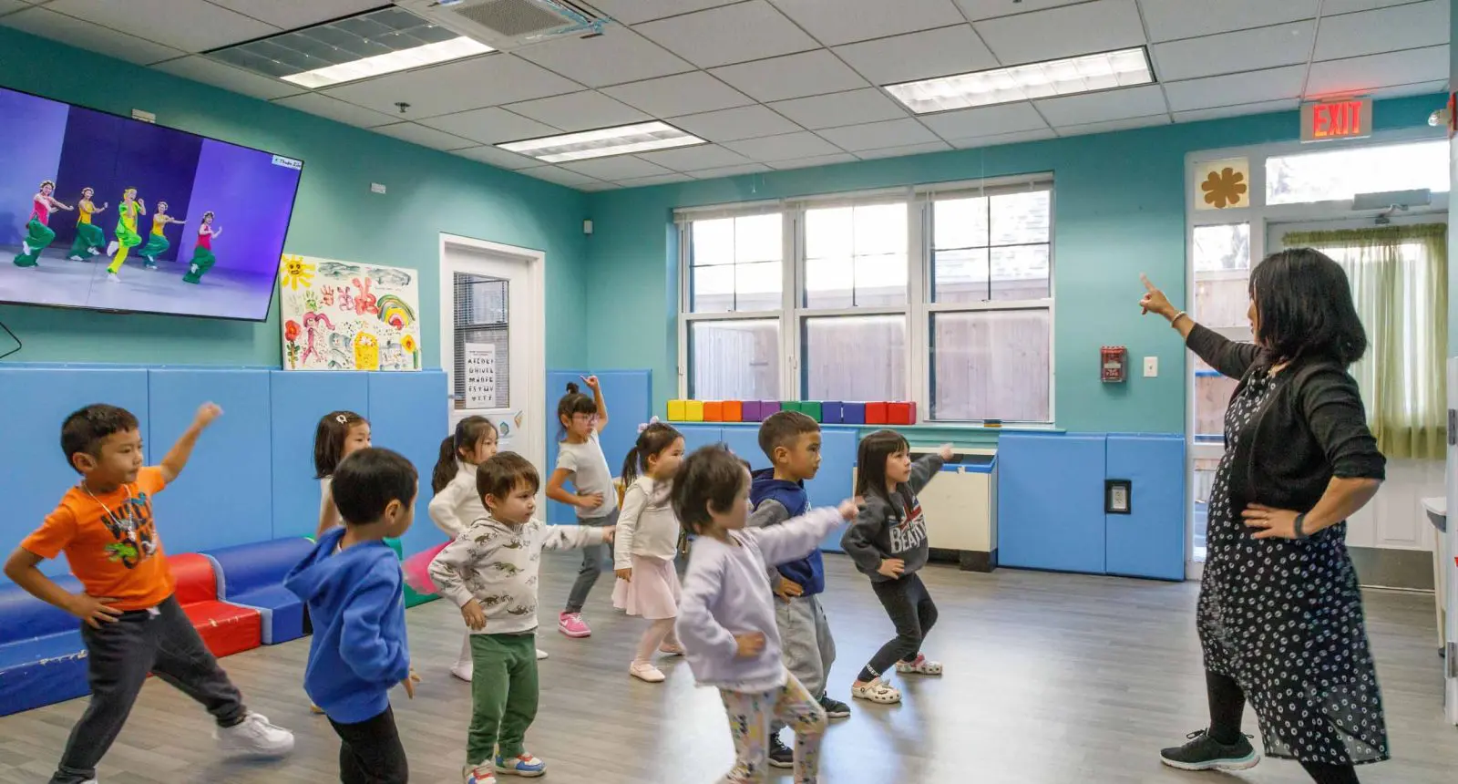 A group of preschool-age children in an exercise class at a facility that received a Children's Investment Fund grant.
