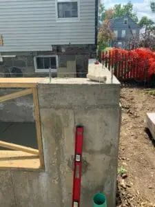 image of exterior wall with red slope measure