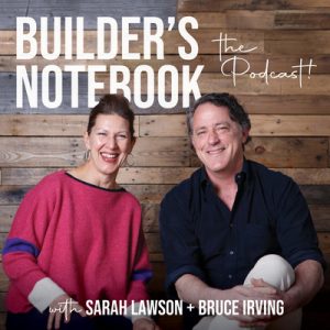 Builder's Notebook "The Podcast" promotional photo with Sarah Lawson + Bruce Irving in front of a woodplank wall. Sarah is wearing a hot pink sweater and Bruce is wearing a navy collared shirt.